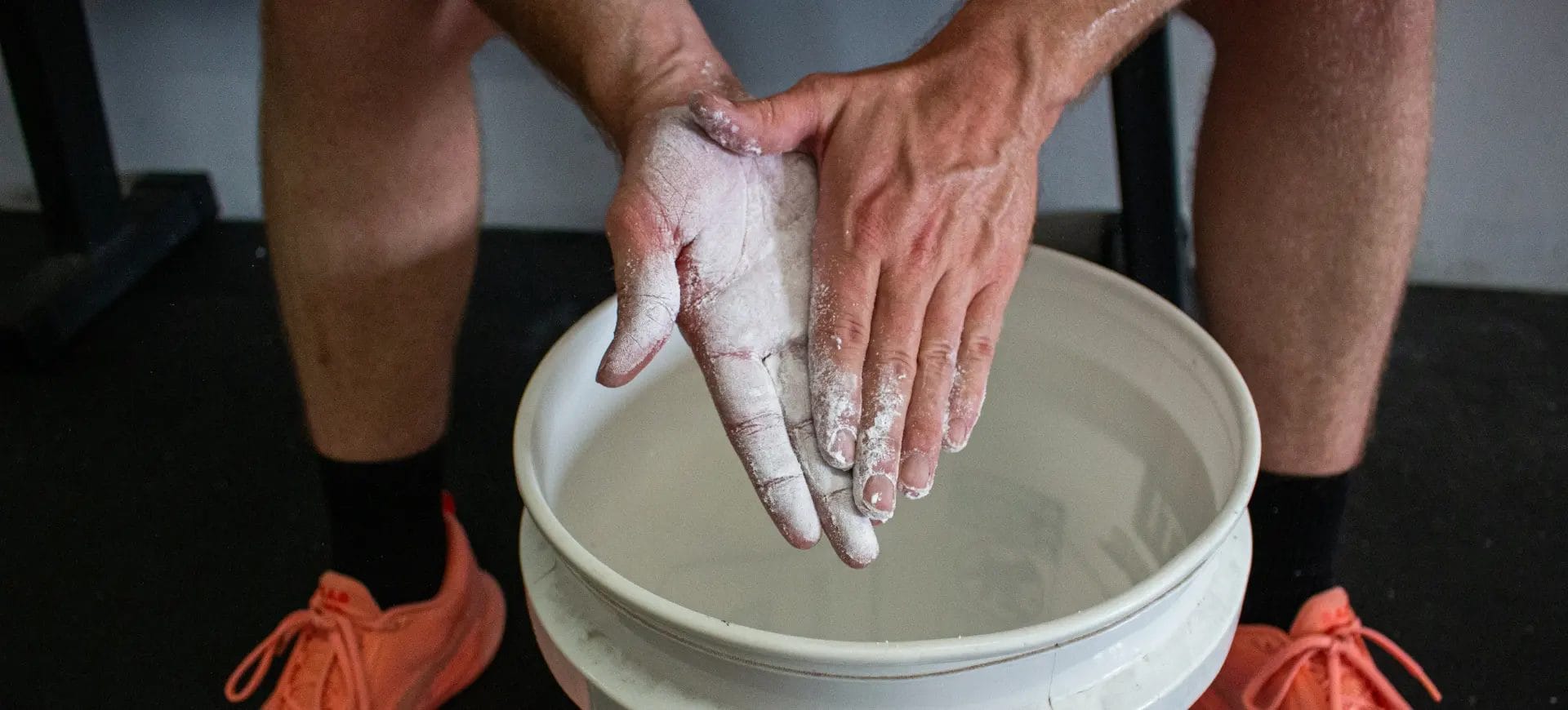 A close-up of arms applying a chokehold